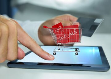 Conceptual image of luxury e-tailing, showing a tablet with a shopping cart and sale items, reflecting the expertise of Daiyra 360 Communications.
