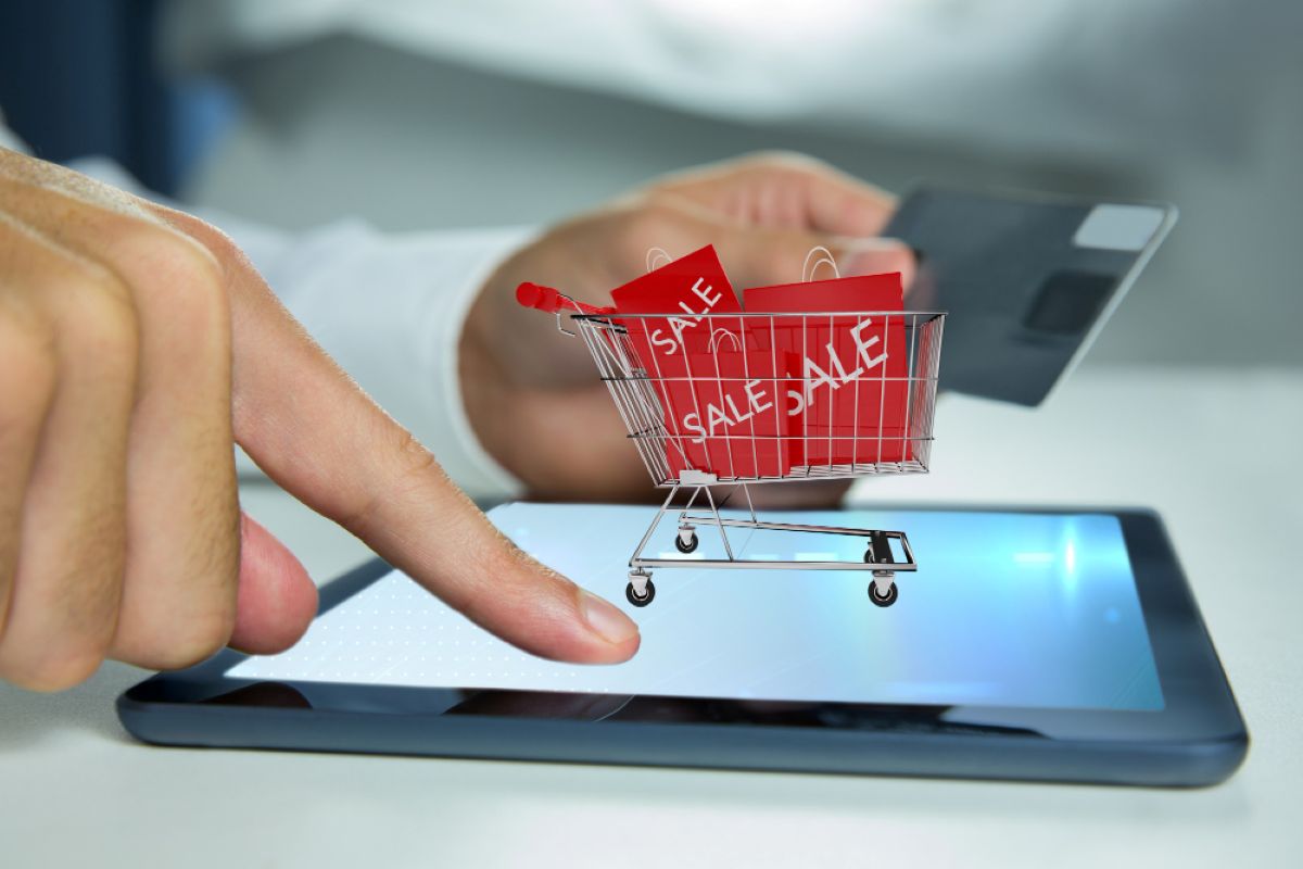 Conceptual image of luxury e-tailing, showing a tablet with a shopping cart and sale items, reflecting the expertise of Daiyra 360 Communications.